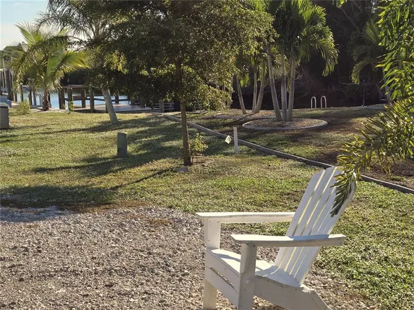 a view of a yard with large trees