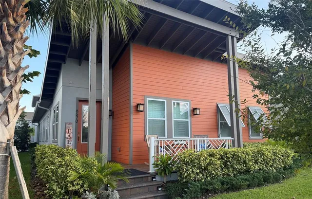 a view of a house with a tree