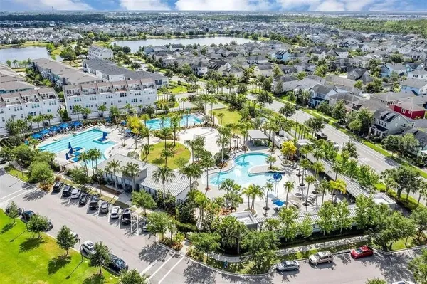an aerial view of residential building and lake