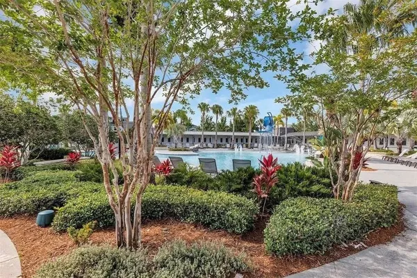 a view of swimming pool with outdoor seating and a potted plant