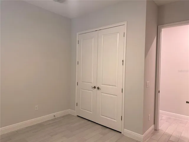 an empty room with closet area