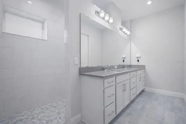 a bathroom with a sink a vanity and a mirror