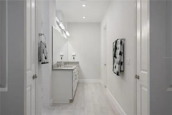 a bathroom with a shower and a sink