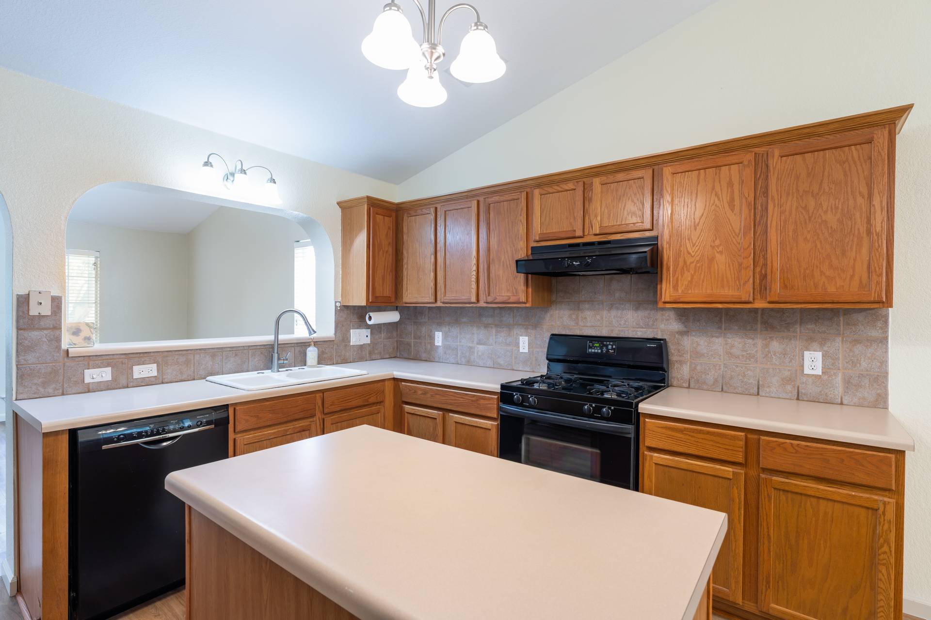 5911 Steiner Kyle, TX 78640 - Photo 12 of 36 a kitchen with a sink a stove and cabinets