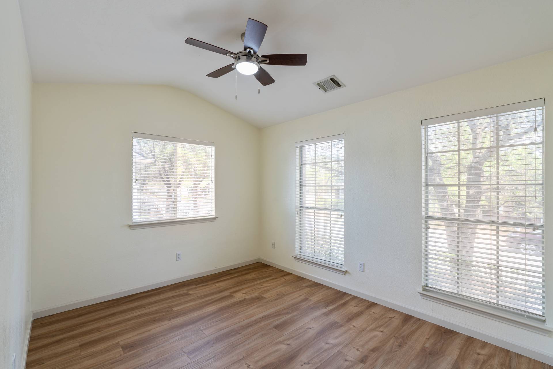 5911 Steiner Kyle, TX 78640 - Photo 21 of 36 a view of an empty room with wooden floor and a window