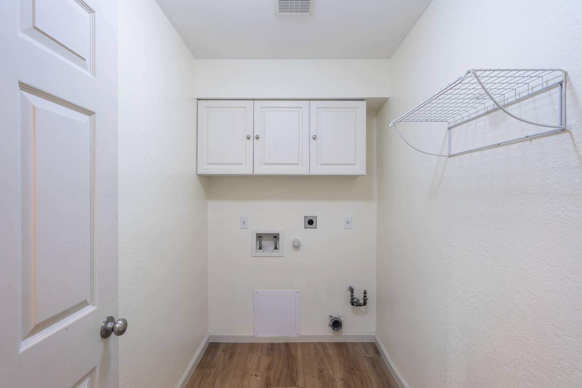 5911 Steiner Kyle, TX 78640 - Photo 26 of 36 a view of storage and utility room with wooden floor