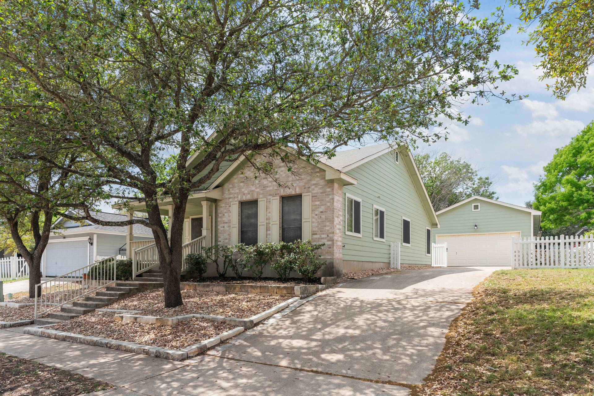 5911 Steiner Kyle, TX 78640 - Photo 6 of 36 a front view of a house with a garden