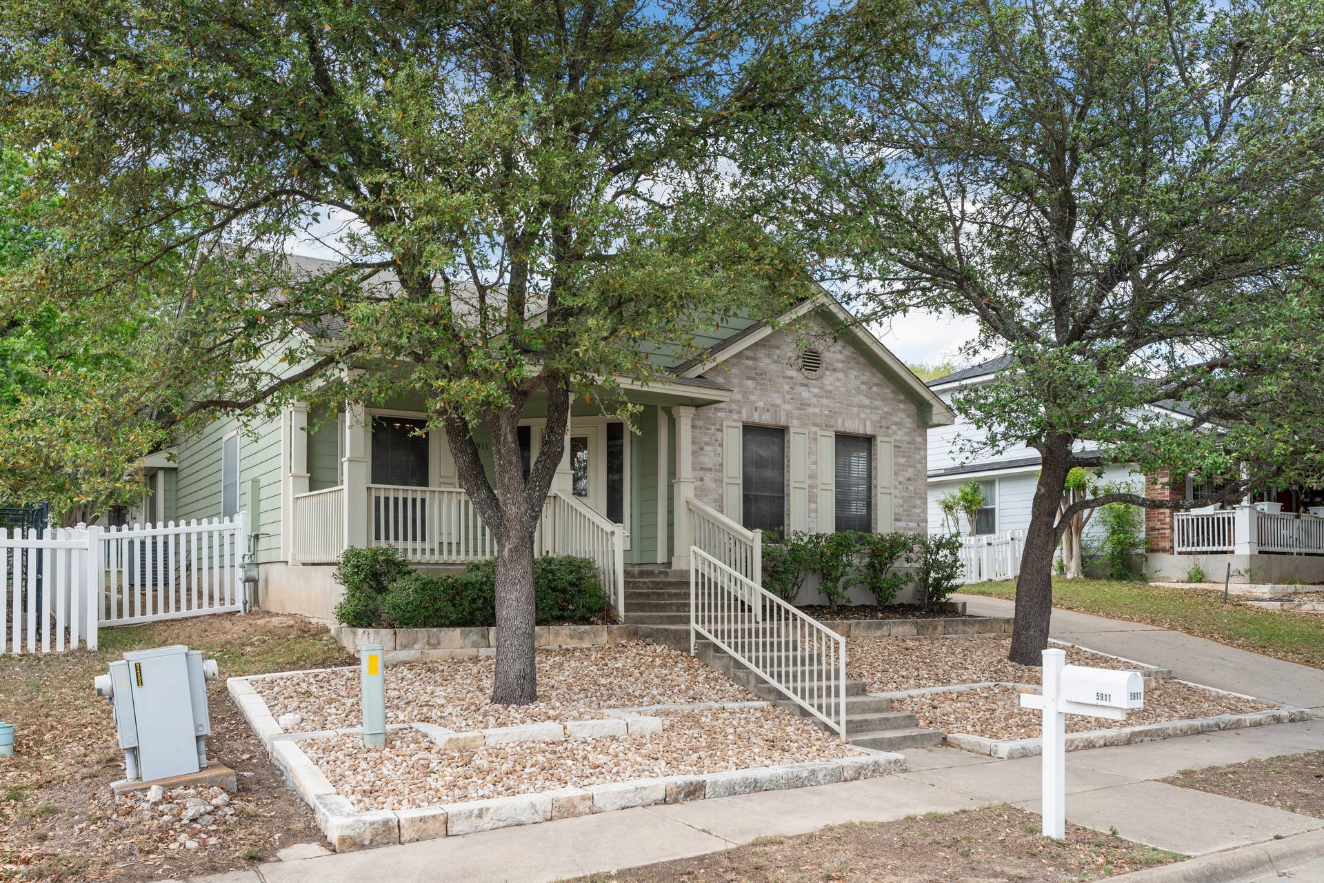 5911 Steiner Kyle, TX 78640 - Photo 7 of 36 a front view of a house with garden