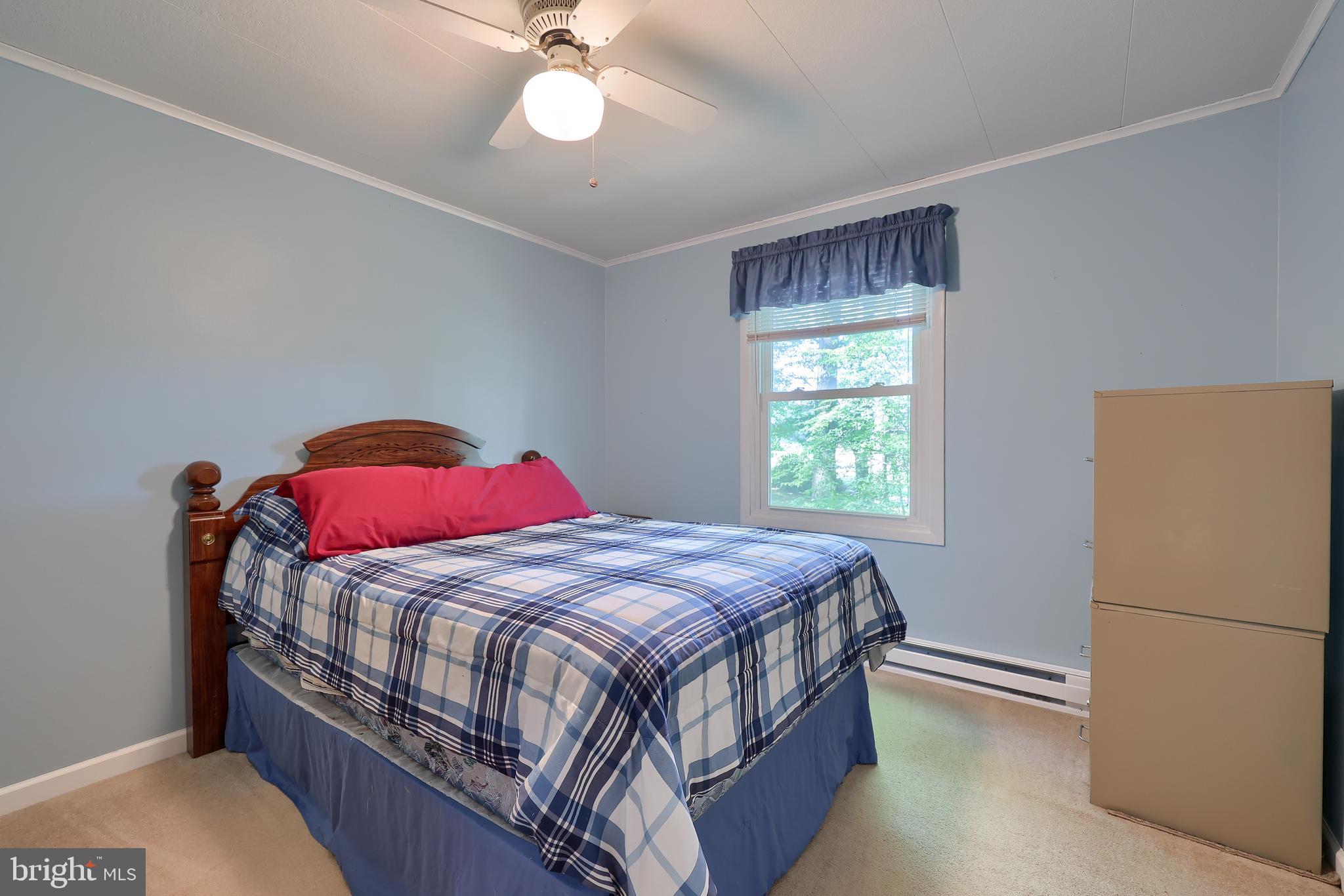 4664 Beards School Road Spring Grove, PA 17362 - Photo 23 of 50 a bedroom with a bed and window