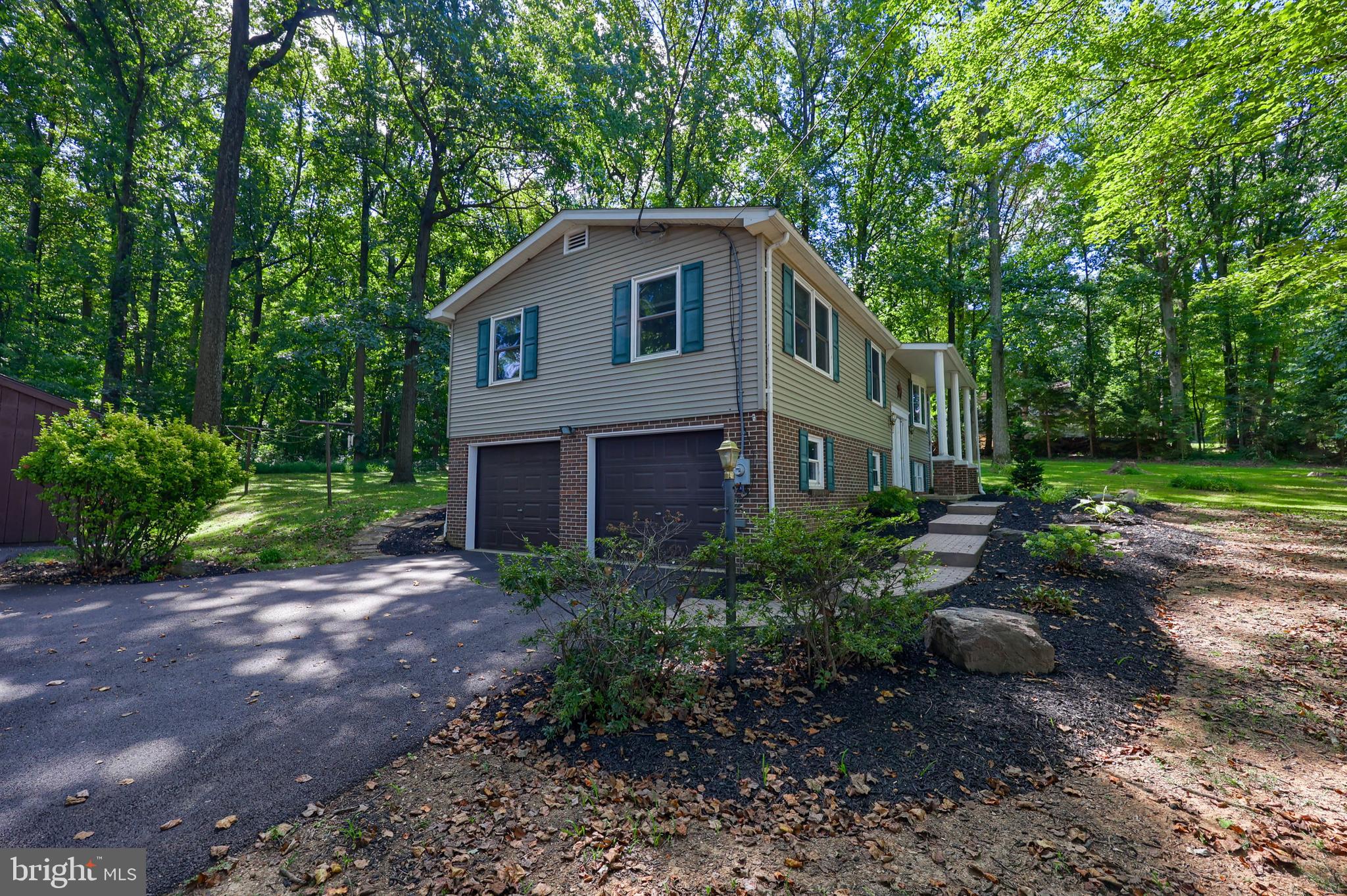 4664 Beards School Road Spring Grove, PA 17362 - Photo 5 of 50 a view of a house in front of a yard with plants and large trees