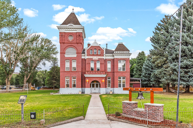 View of property featuring a fenced front yard