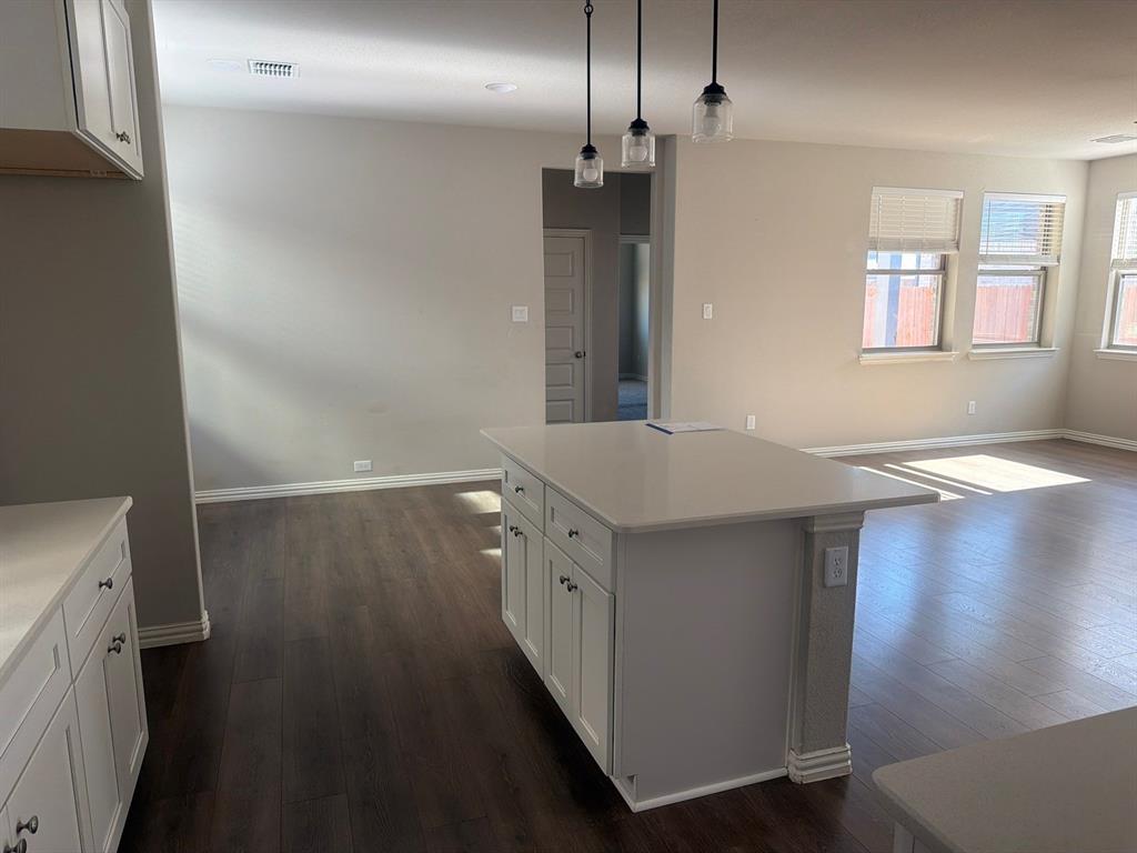 3936 Chesapeake Lane Forney, TX 75126 - Photo 12 of 40 wooden floor in an empty room with a window