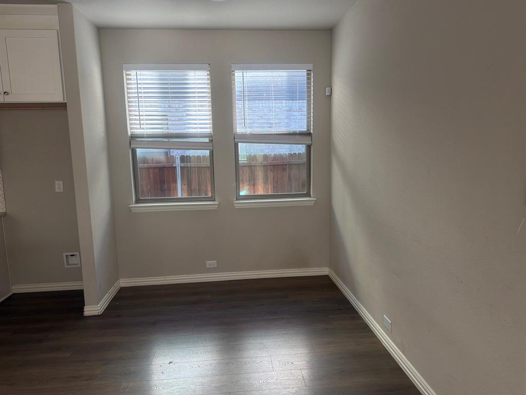 3936 Chesapeake Lane Forney, TX 75126 - Photo 5 of 40 an empty room with wooden floor and windows