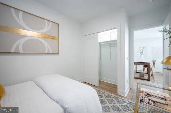 a bedroom with a bed and a mirror