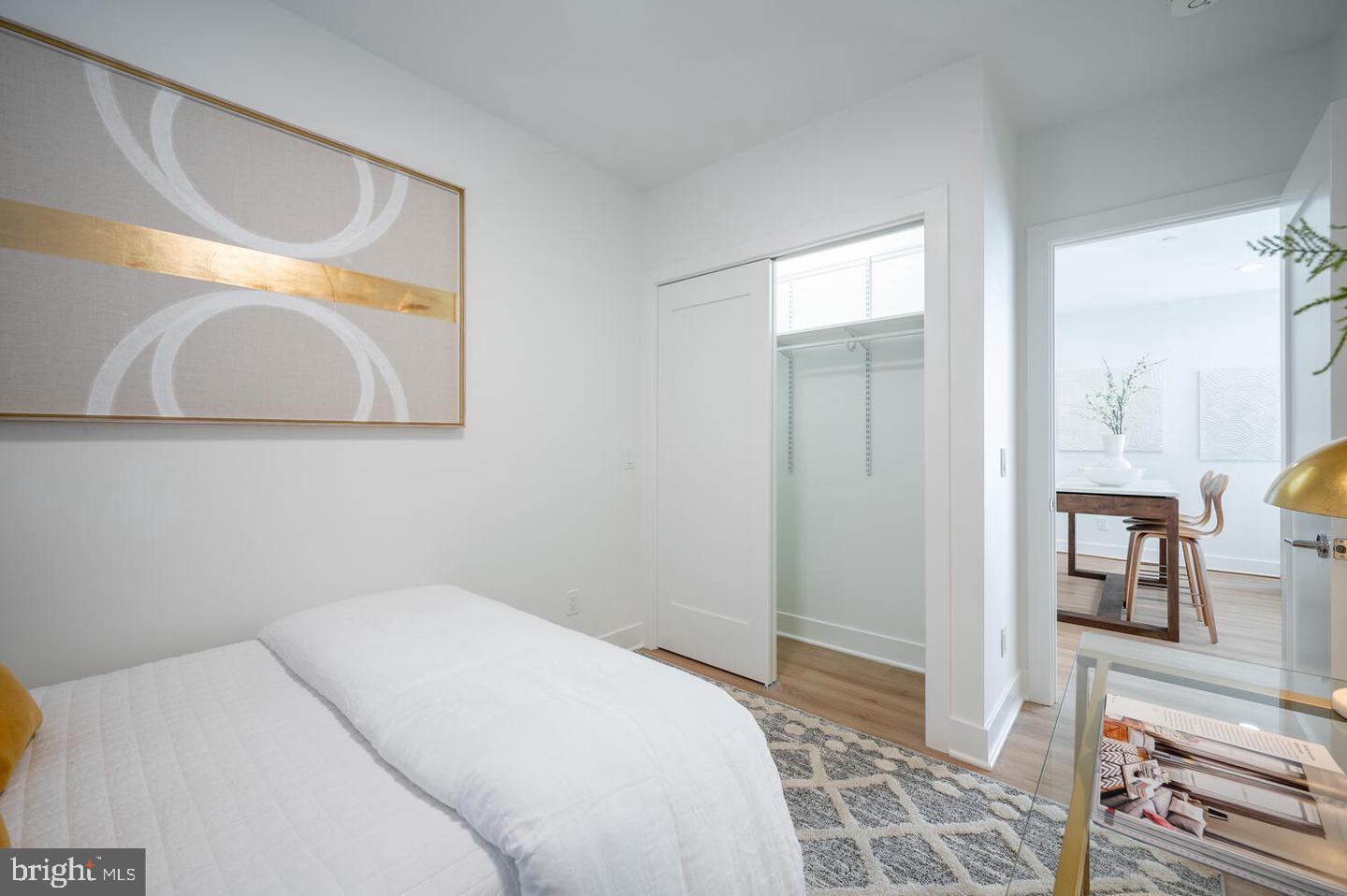 1228 Brentwood Road Northeast, Unit 1 Washington, DC 20018 - Photo 12 of 21 a bedroom with a bed and a mirror