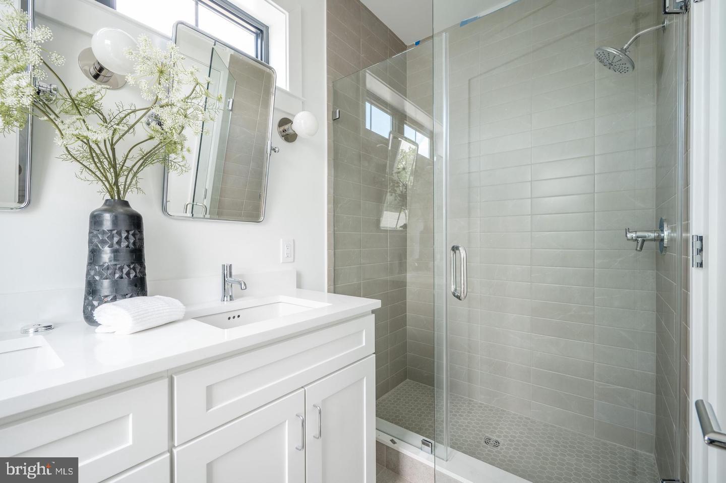 1228 Brentwood Road Northeast, Unit 1 Washington, DC 20018 - Photo 13 of 21 a bathroom with a sink and a mirror