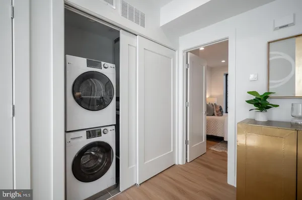 a view of a hallway with washer and dryer