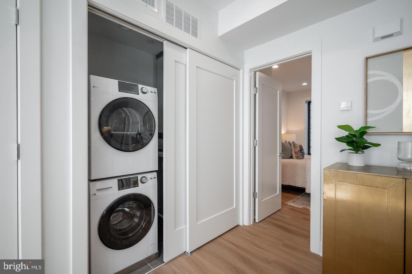 1228 Brentwood Road Northeast, Unit 1 Washington, DC 20018 - Photo 17 of 21 a view of a hallway with washer and dryer