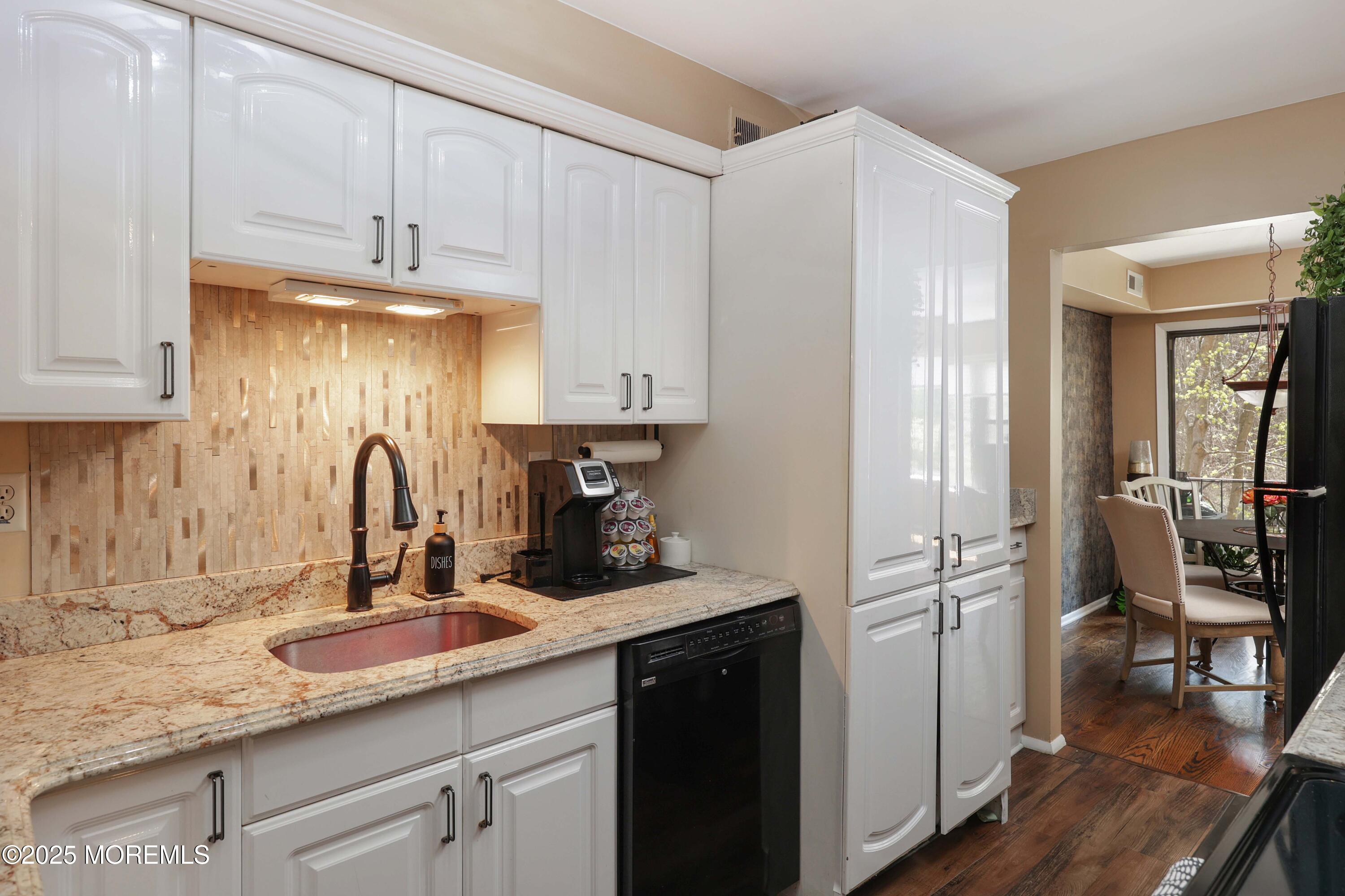 200 Portland Road, Unit D15 Highlands, NJ 07732 - Photo 13 of 56 a kitchen with a sink and cabinets