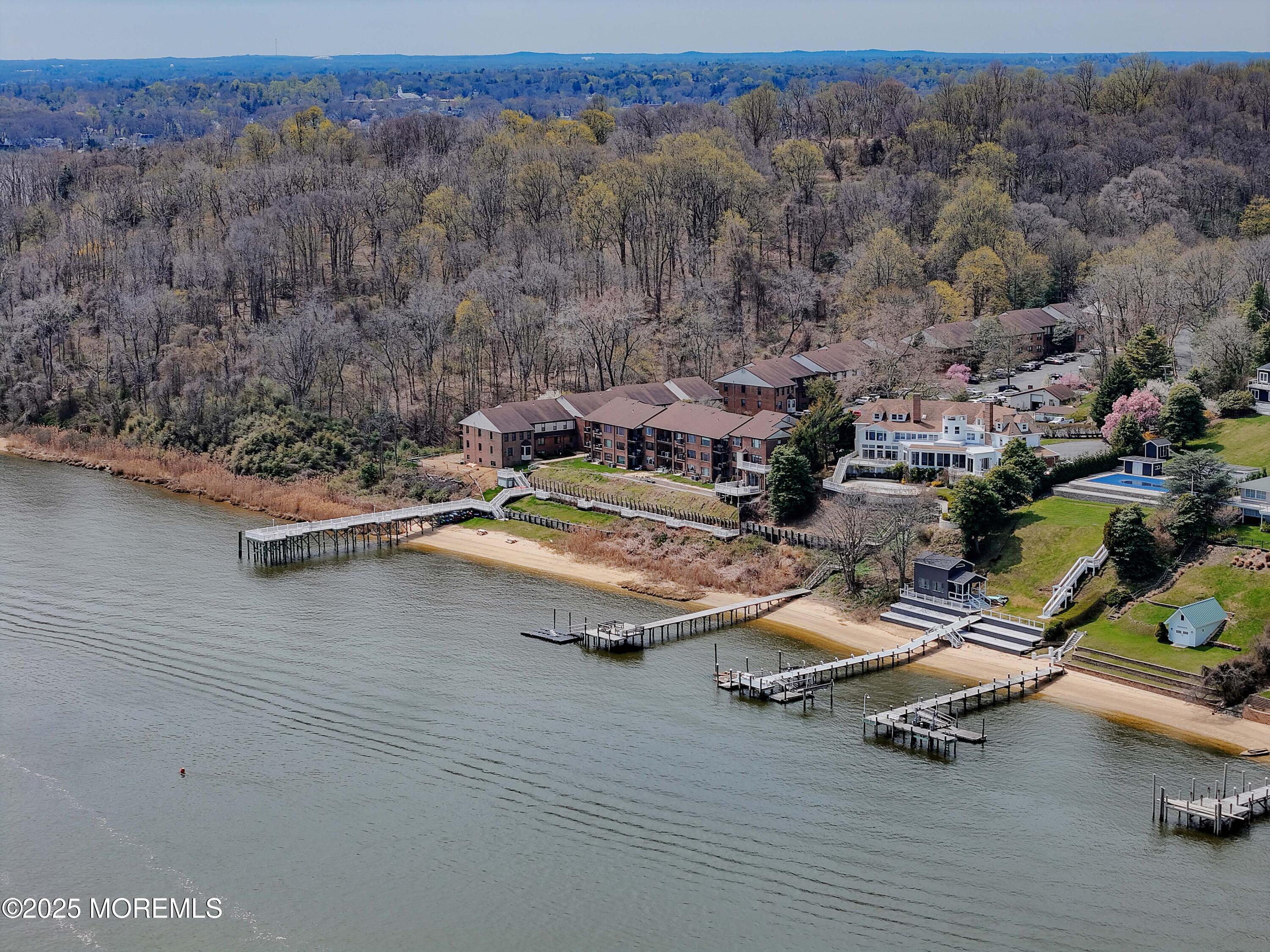 200 Portland Road, Unit D15 Highlands, NJ 07732 - Photo 4 of 56 an aerial view of a swimming pool with lounge chair