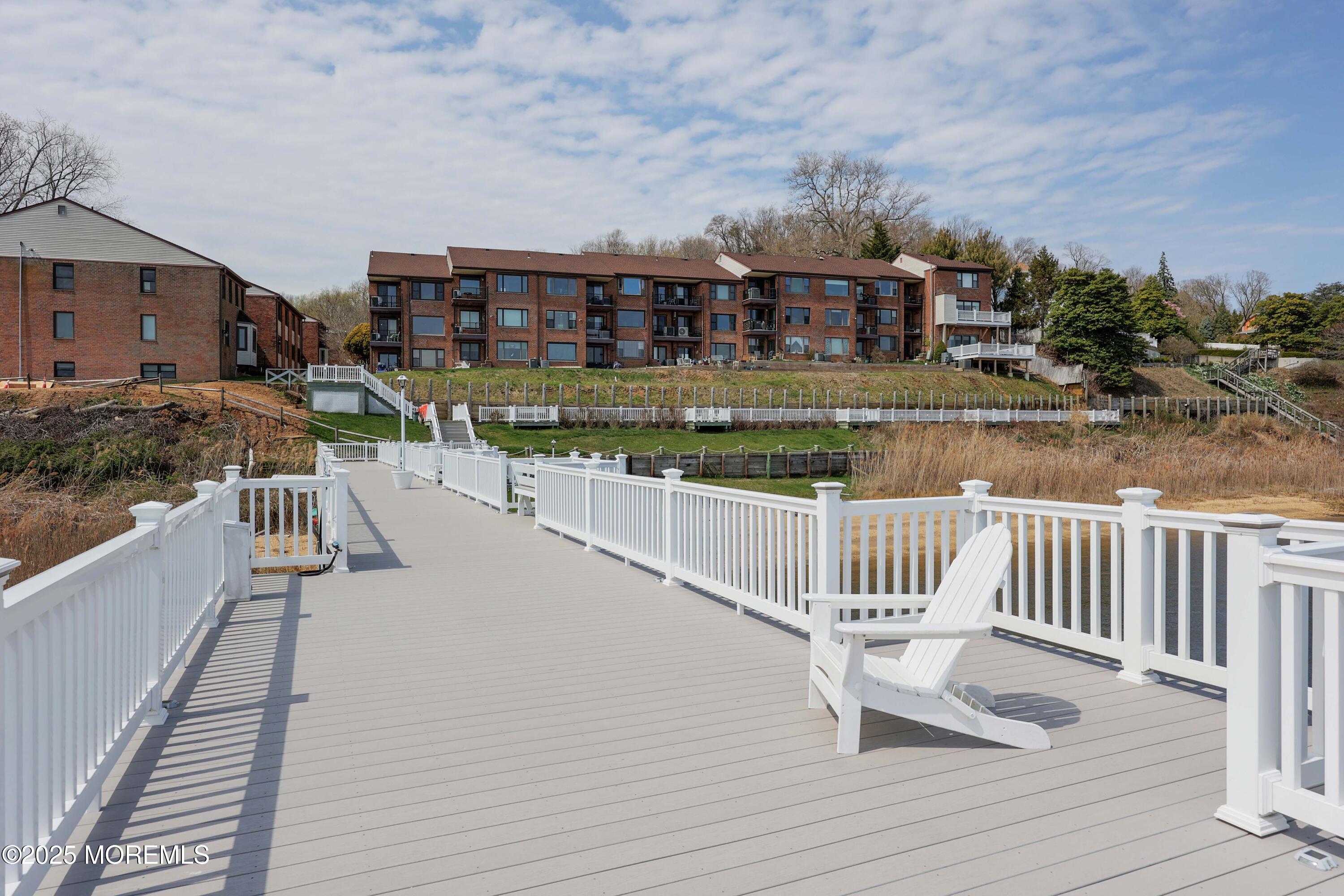 200 Portland Road, Unit D15 Highlands, NJ 07732 - Photo 42 of 56 a view of balcony with two chairs and wooden floor