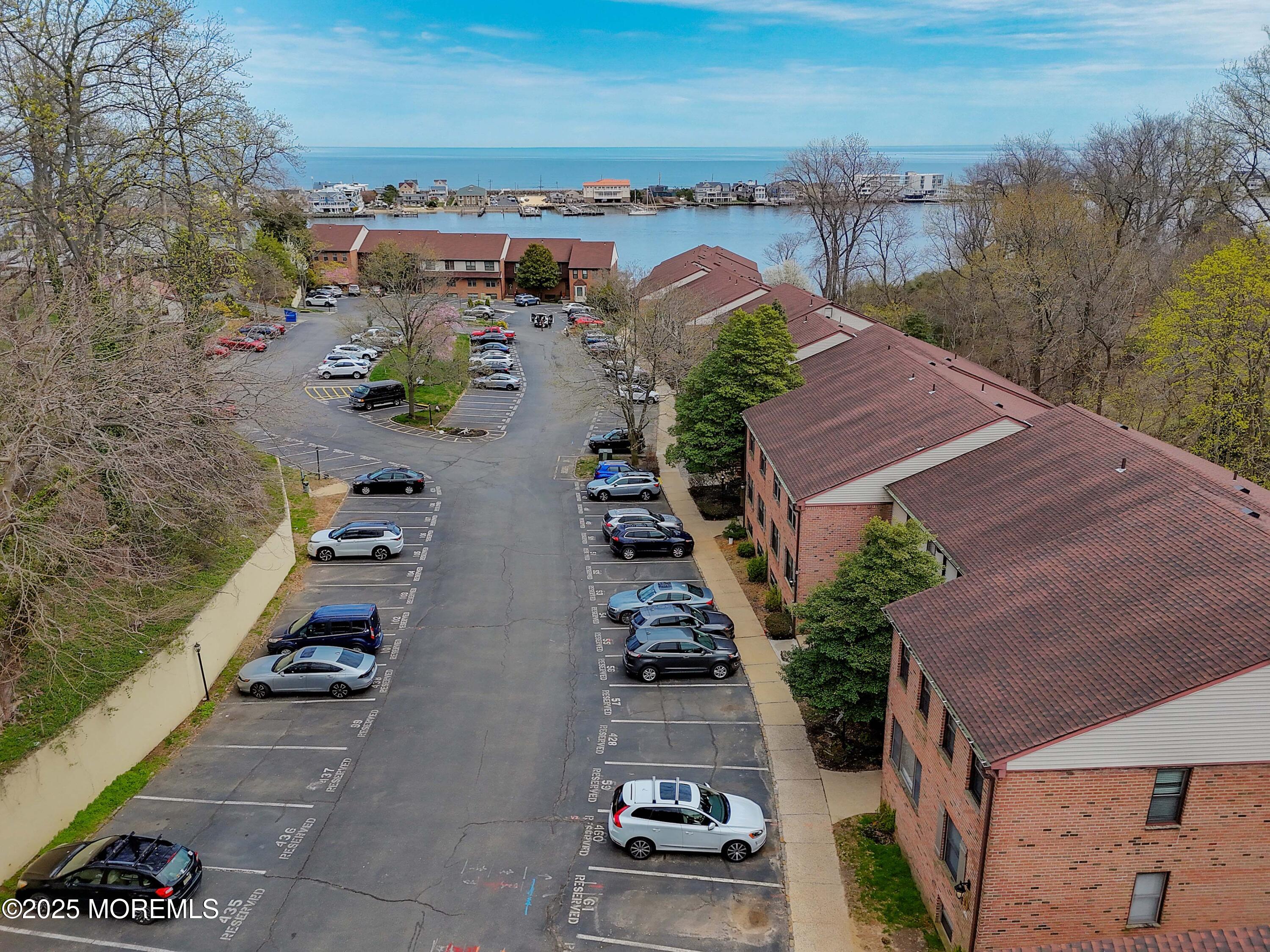 200 Portland Road, Unit D15 Highlands, NJ 07732 - Photo 8 of 56 an aerial view of multiple houses with outdoor space