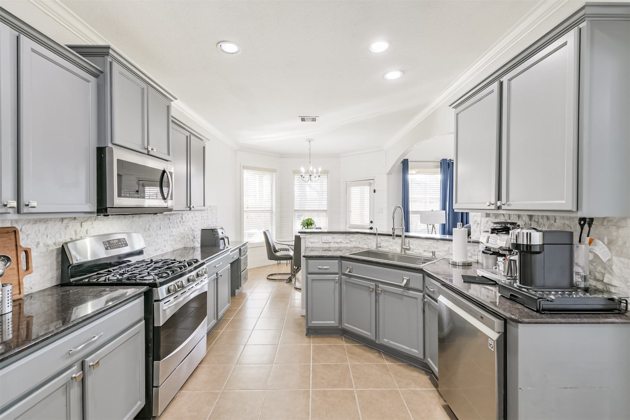 2602 Fort Settlement Trail Spring, TX 77373 - Photo 28 of 50 This kitchen is a chef's dream, featuring a premium five-burner gas oven and stove for exceptional cooking performance.