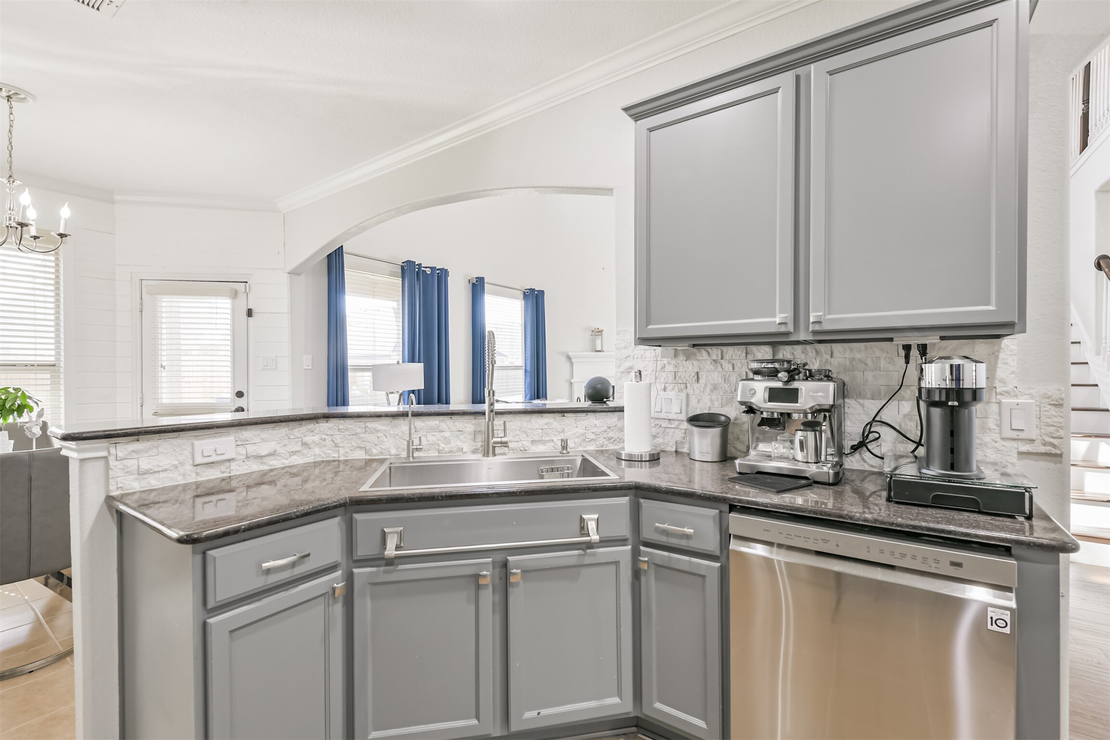 2602 Fort Settlement Trail Spring, TX 77373 - Photo 31 of 50 This kitchen features a stone backsplash, an oversized sink, and a built-in dishwasher. Service bar for informal dining.