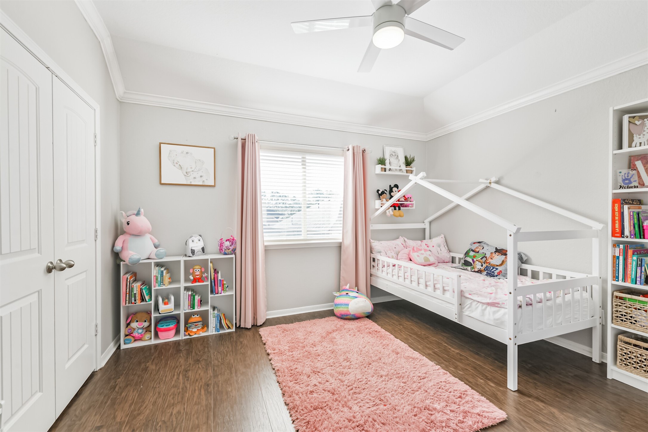 2602 Fort Settlement Trail Spring, TX 77373 - Photo 40 of 50 The second upstairs bedroom is adorned with elegant crown molding, a lighted ceiling fan, and stylish window treatments, with French doors opening to the closet.