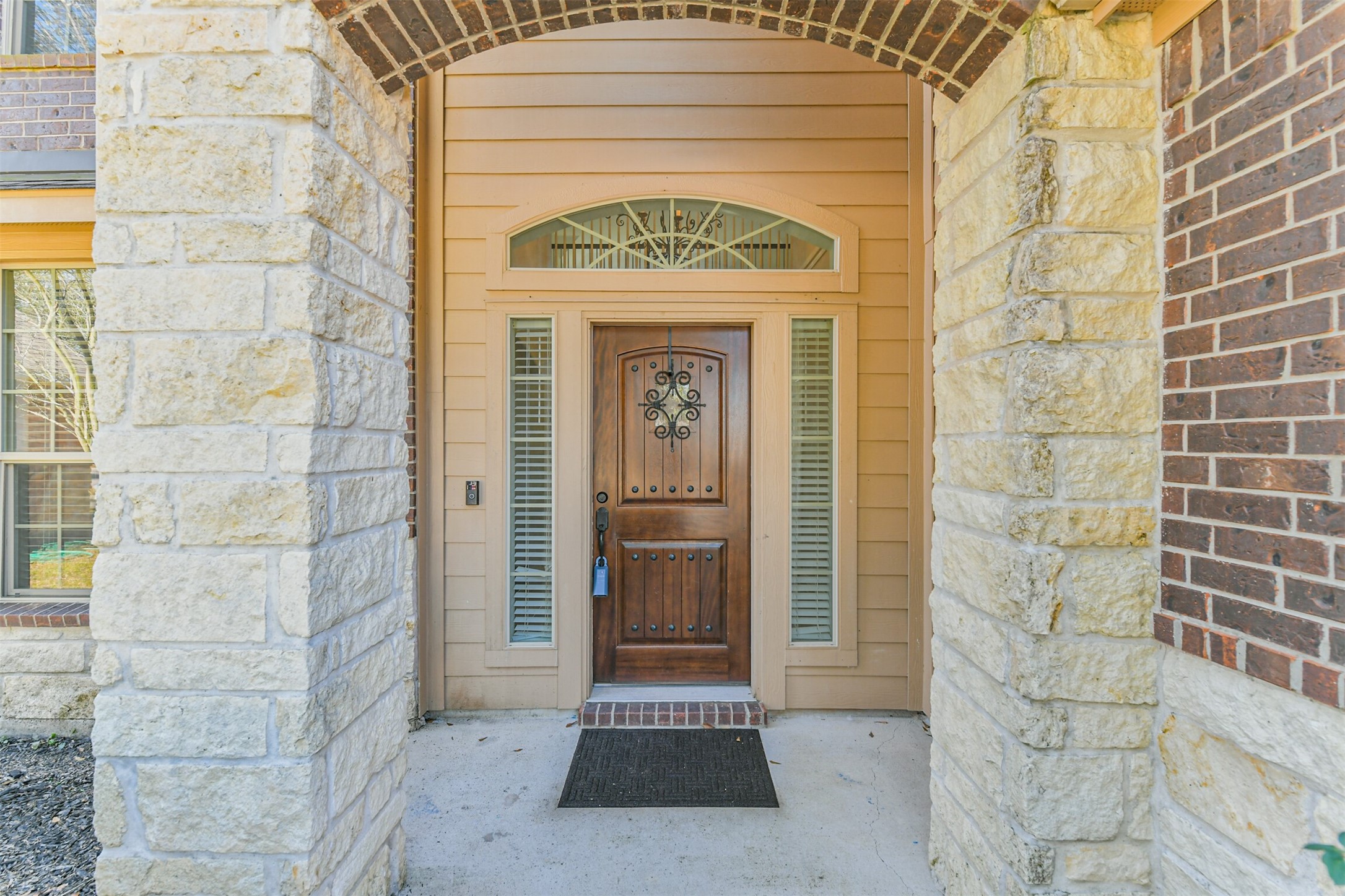 2602 Fort Settlement Trail Spring, TX 77373 - Photo 5 of 50 Solid wood front door framed by sidelight and transom windows.