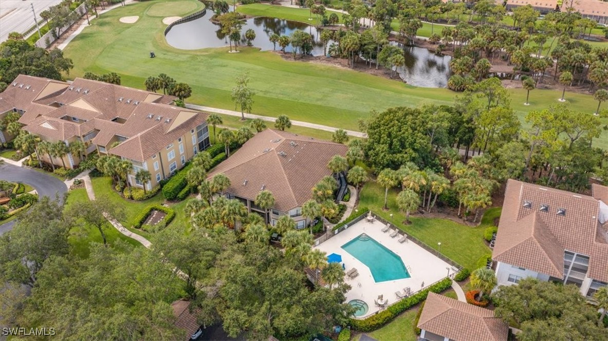 792 Eagle Creek Drive, Unit 101 Naples, FL 34113 - Photo 3 of 16 an aerial view of a house with a yard