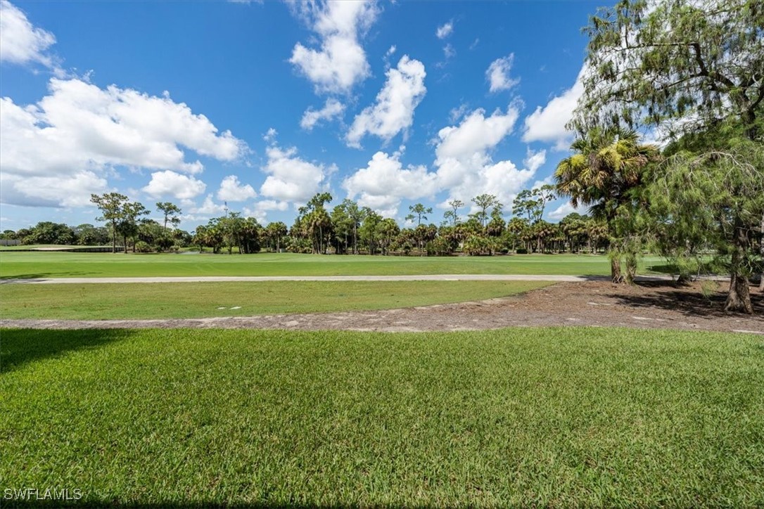 792 Eagle Creek Drive, Unit 101 Naples, FL 34113 - Photo 8 of 16 a view of a park with large trees