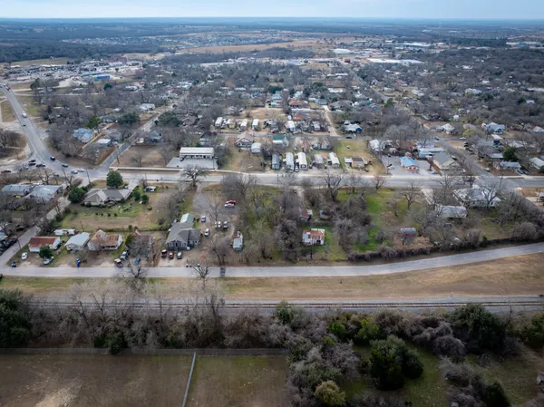 an aerial view of a house with a yard