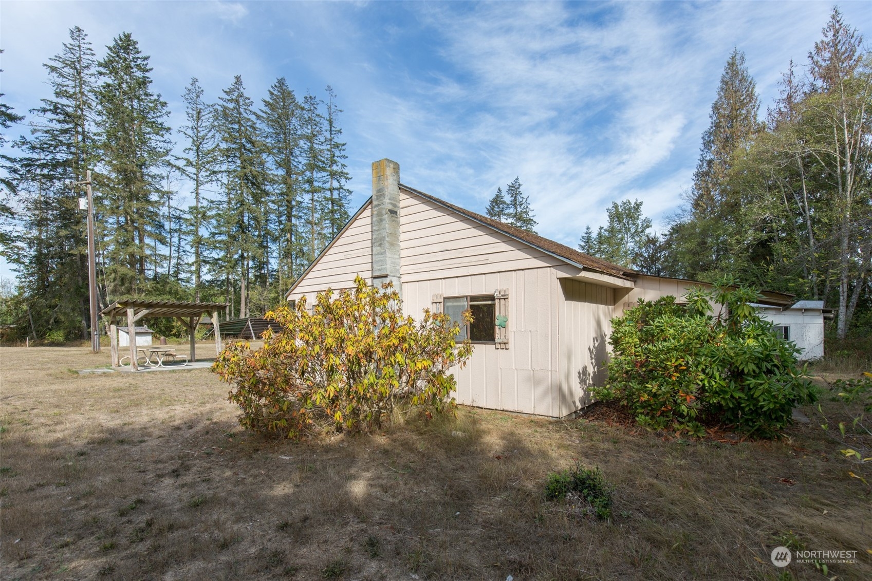 197 Jay Robinson Road Sequim, WA 98382 - Photo 19 of 40 a view of a house with large trees