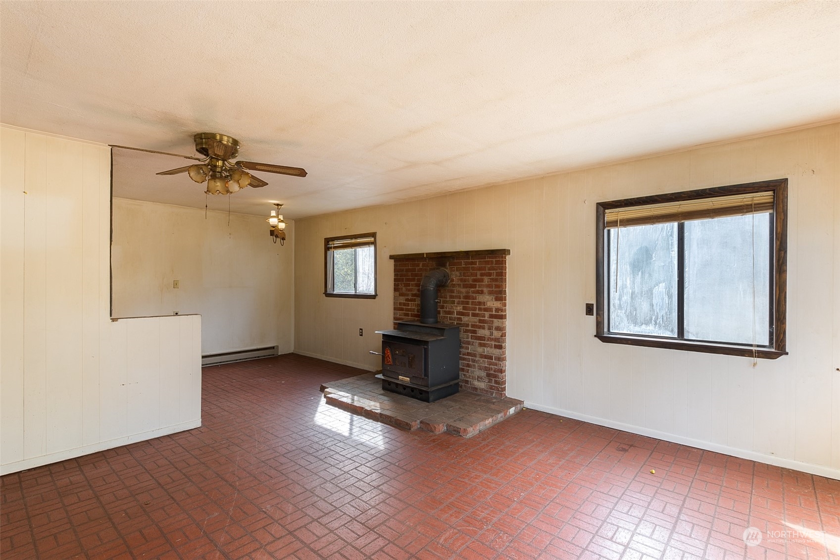 197 Jay Robinson Road Sequim, WA 98382 - Photo 4 of 40 wooden floor in an empty room with a window