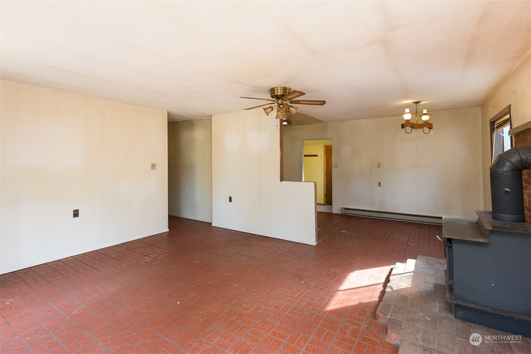 197 Jay Robinson Road Sequim, WA 98382 - Photo 5 of 40 a view of a livingroom with a flat screen tv and fireplace
