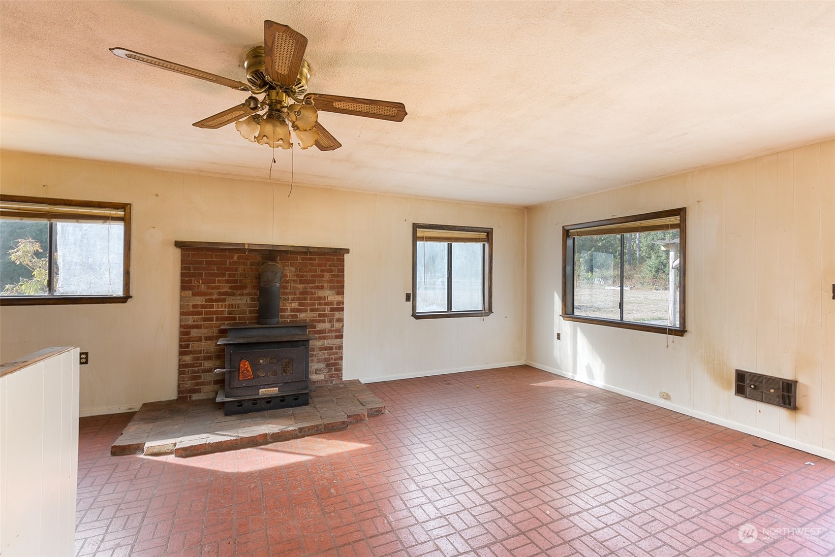 197 Jay Robinson Road Sequim, WA 98382 - Photo 6 of 40 a view of livingroom with window fireplace and windows