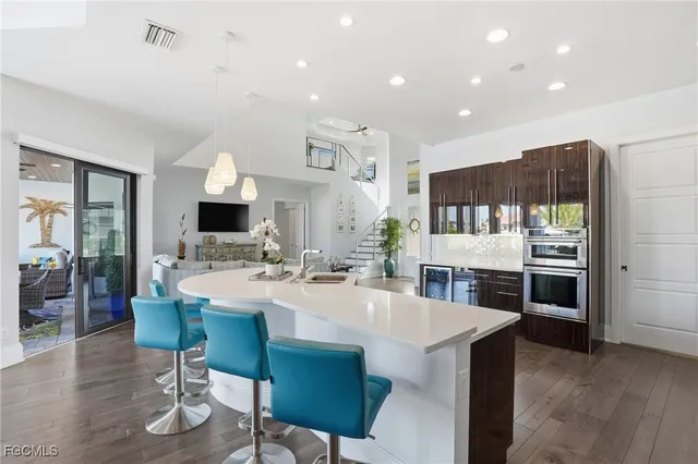 a large kitchen with a table and chairs