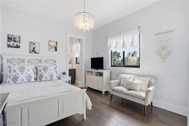 a spacious bedroom with a bed and a couch