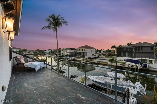 a view of a balcony with chairs
