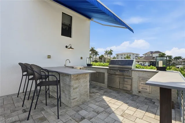 a open kitchen with a table and chairs