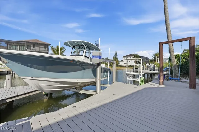 a roof deck with table and chairs