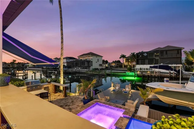 a view of swimming pool with outdoor seating