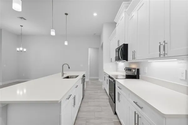 an empty room with fan and a ceiling fan