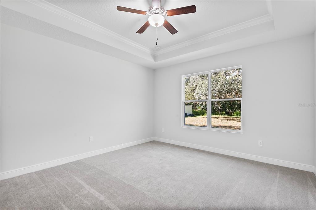 304 North Jungle Road Geneva, FL 32732 - Photo 21 of 49 an empty room with a window and a fan
