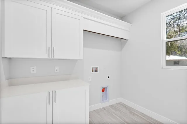 a bathroom with a sink and a window