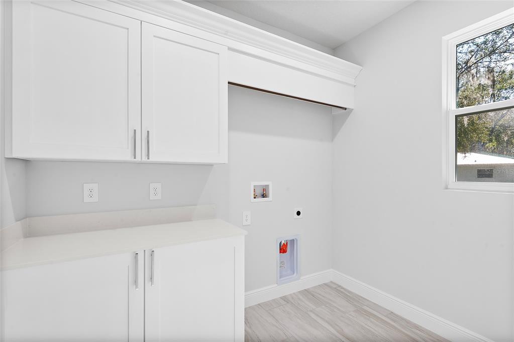 304 North Jungle Road Geneva, FL 32732 - Photo 29 of 49 a bathroom with a sink and a window