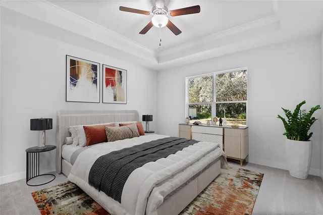 a bedroom with a large bed and a window