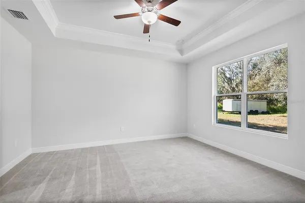 a spacious bathroom with a double vanity sink a large mirror a shower and a bathtub