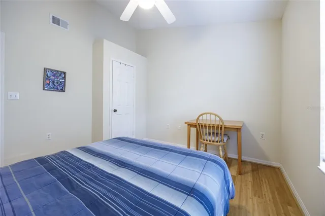 a bedroom with a bed and a table